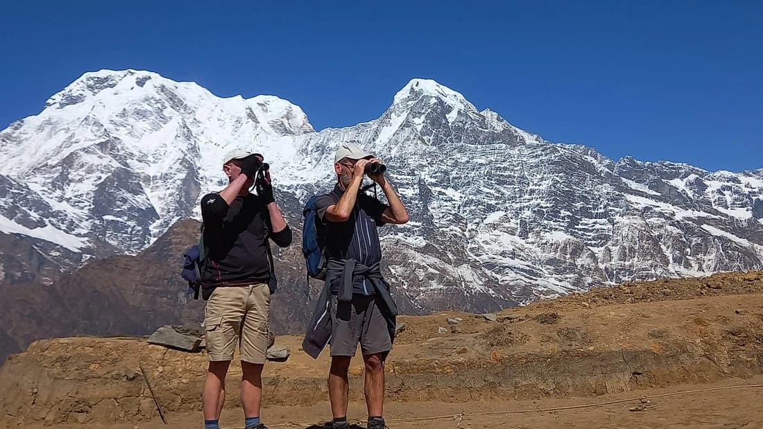 guys watching mountain in Mardi Himal Trek