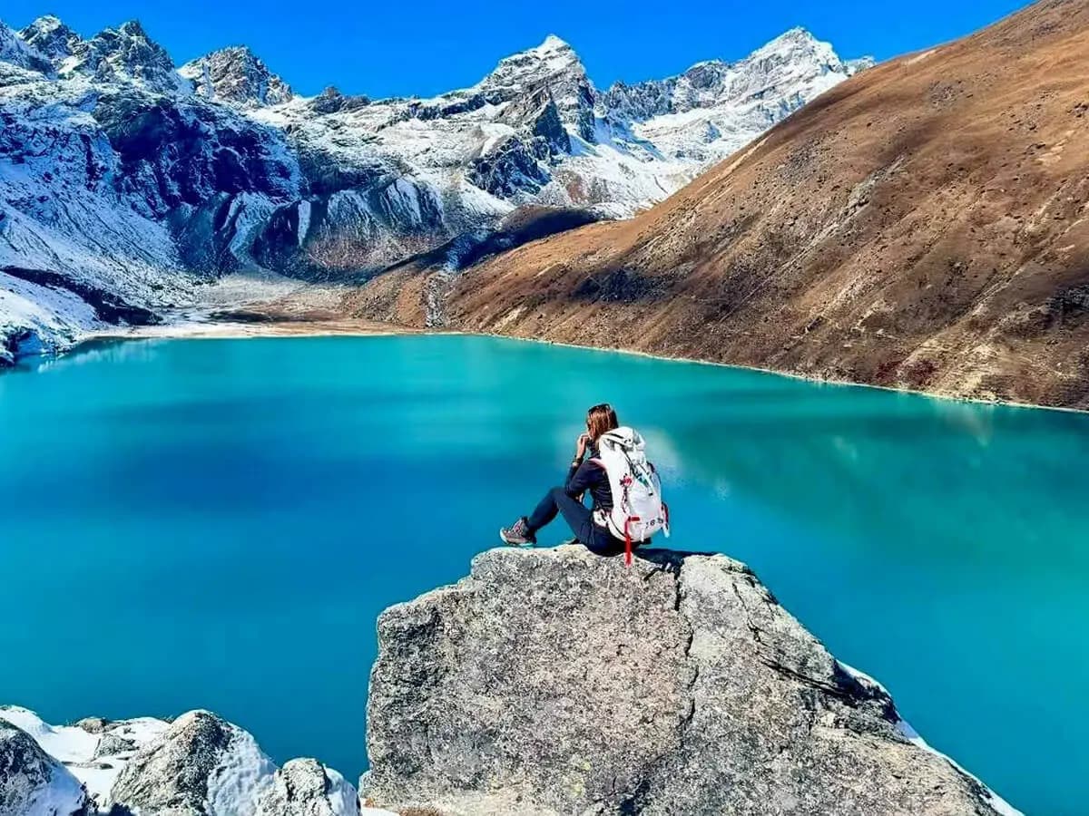 traveller enjoying the the view from gokyo lake trek