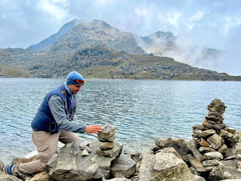 Man Making stone house infront of the gosaikunda lake